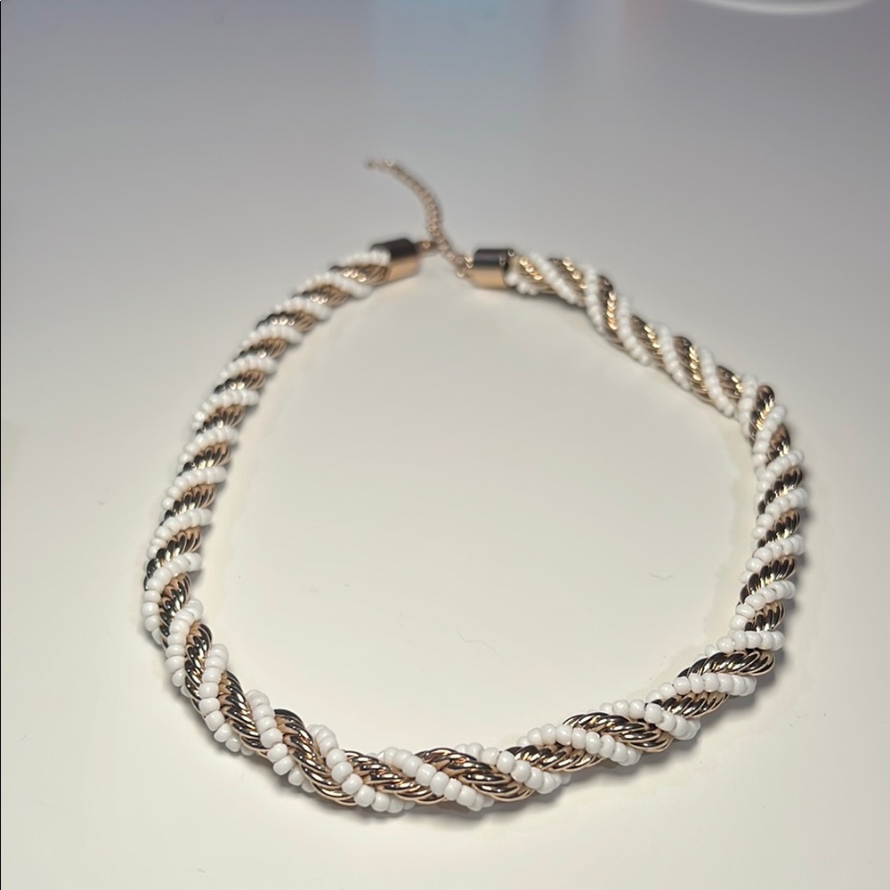 Elegant Gold and White Twisted Necklace